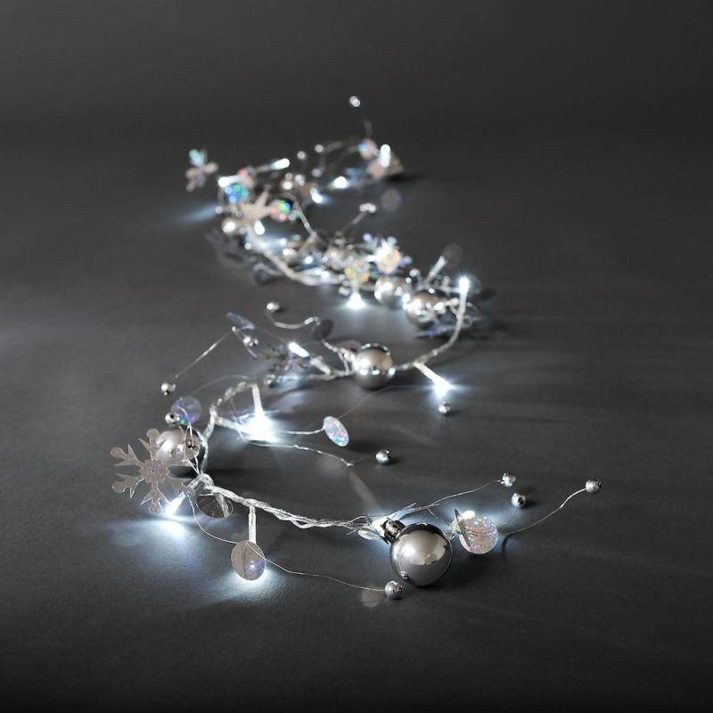 Konstsmide 3189-903 - LED Dekolichterkette, silberfarbene Perlen und Schneekristalle, 20 kalt weiße Dioden, 24V Innentrafo, transparentes Kabel